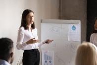 Woman presenting to group of professionals